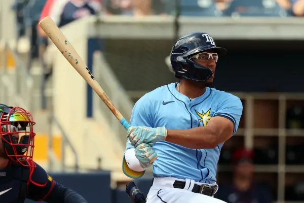 This photo shows Greg Jones swinging a bat. He’s wearing Tampa Bay Rays gear.