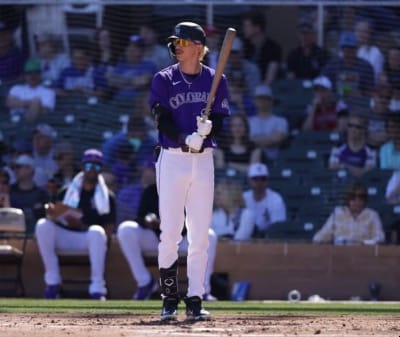 Zac Veen (with blond hair) stands at the plate, bat in hand.