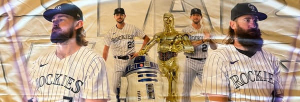 B-Rod and Charlie hold purple sabers while RyMac and KB look on with R2D2 & C-3PO.